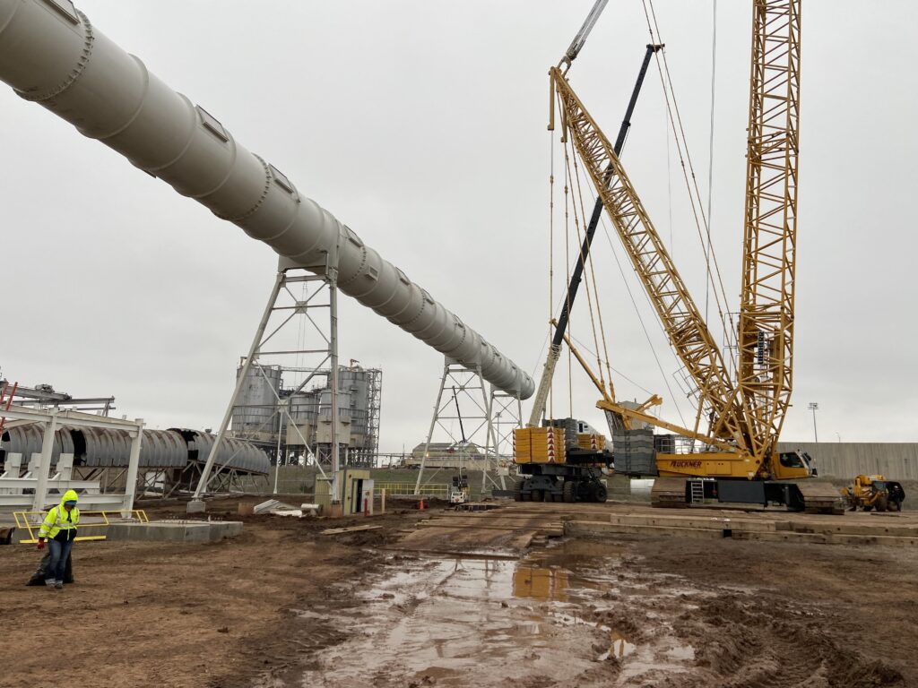 Crane lifting a tube gallery section into place