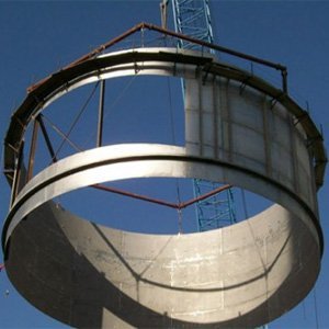 Steel ring being lifted into place
