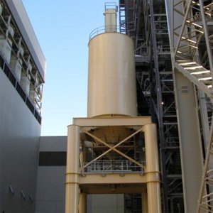 Elevated yellow lime storage silo